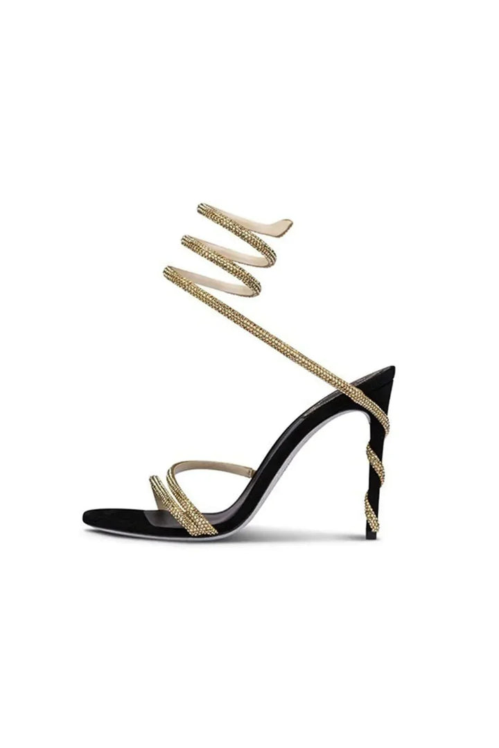 Close-up of sparkling women's crystal embellished spiral ankle wrap stiletto high heels, ideal party and formal footwear.