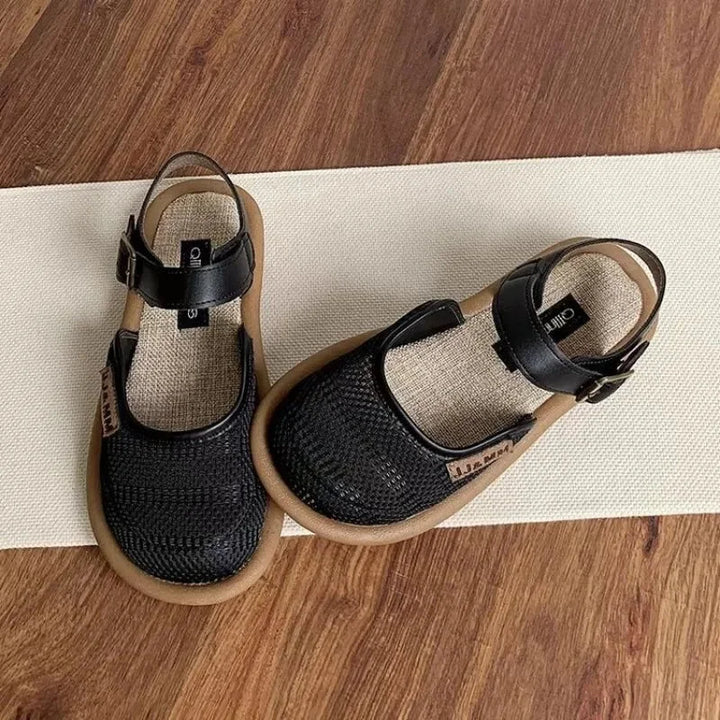 Adjustable buckle women's sandals, offering a comfortable closed-toe wide fit for all-day casual footwear.
