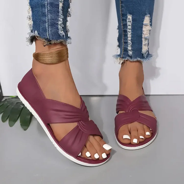 Durable women's cushioned crossover sandals. Non-slip sole & supportive design for safe, comfortable wear.