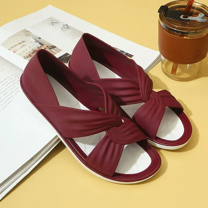 Versatile women's slip-on sandals: cushioned crossover straps provide comfort & a chic look for any outfit.