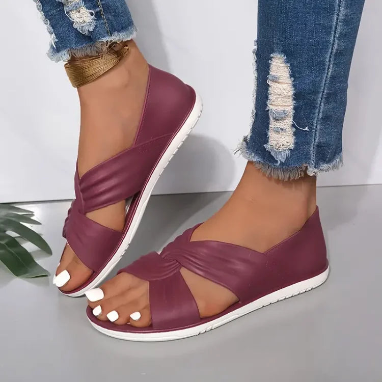Elegant women's crossover sandals with a cushioned footbed for supreme comfort & support. Summer essential.