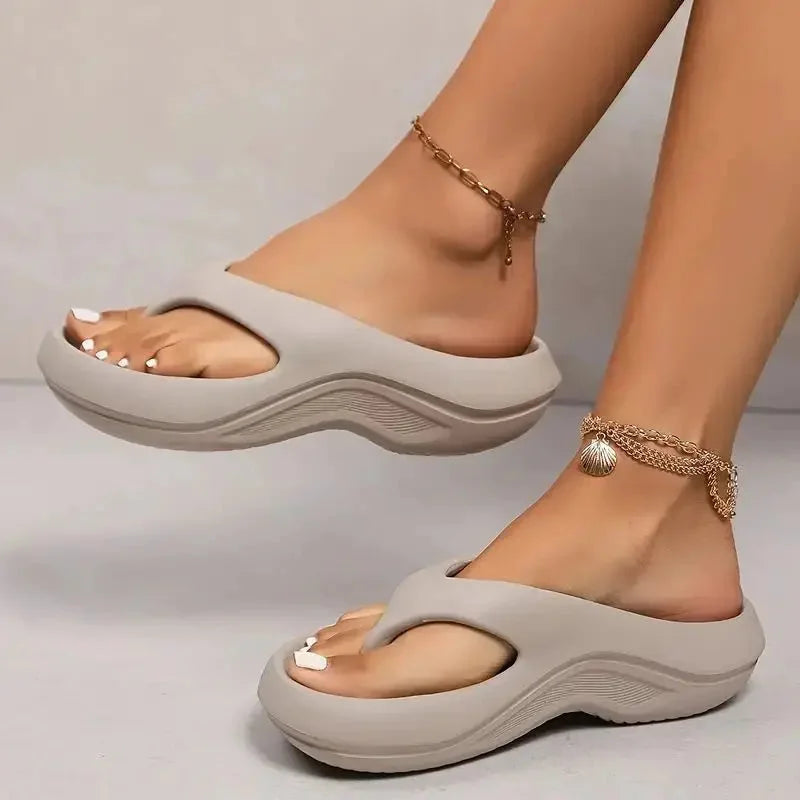 Women's cushioned platform flip flops with cloud-soft comfort, perfect for summer.