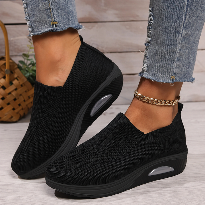 Women's cushioned slip-on sneakers, perfect for all-day comfort and easy wear.