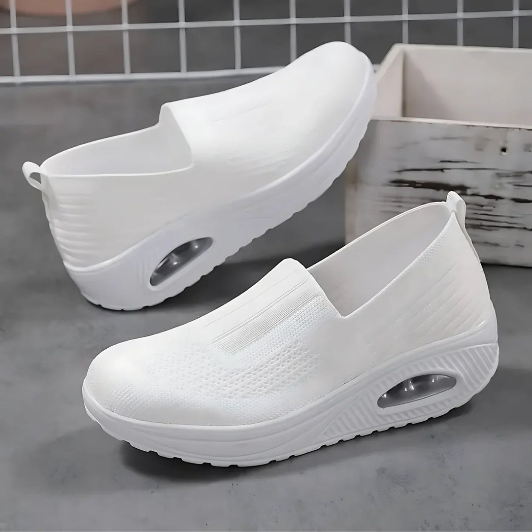 Lightweight women's walking sneakers with plush cushioning for ultimate foot support.