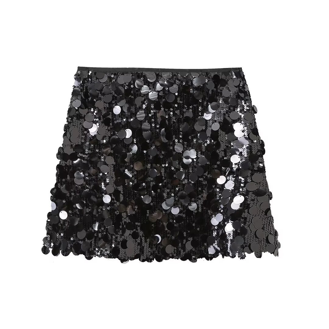 Sparkling women's sequin mini skirt, a glamorous fashion choice for parties and special occasions.