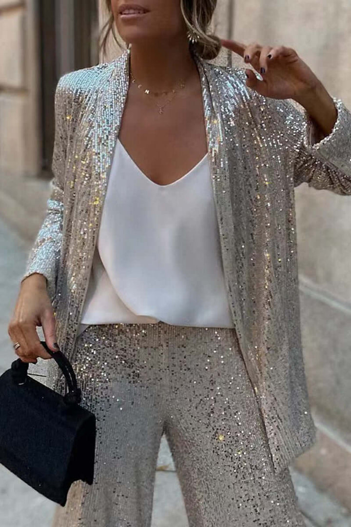 Sparkling women's sequin long sleeve top & wide leg pants set. Ideal glamorous party or evening outfit.