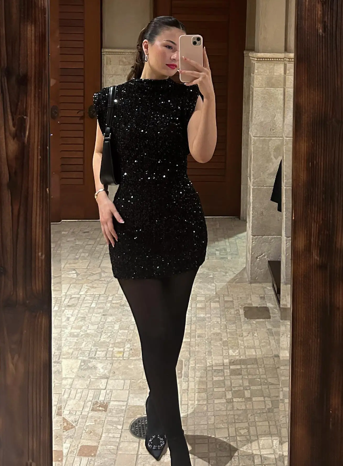 Sparkling silver sequin mini dress for women. Glamorous short party dress, ideal for special evening occasions.