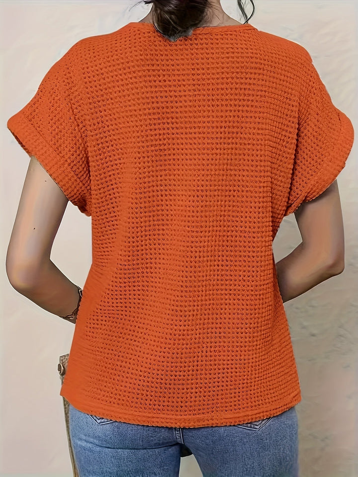 Bold red women's decorative crochet blouse, short sleeve, adds a pop of color to spring/summer outfits.