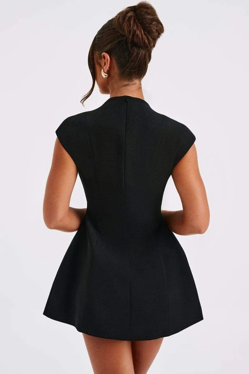 Fashionable women's cap sleeve mini dress with a flattering deep V-neckline and functional front patch pockets.