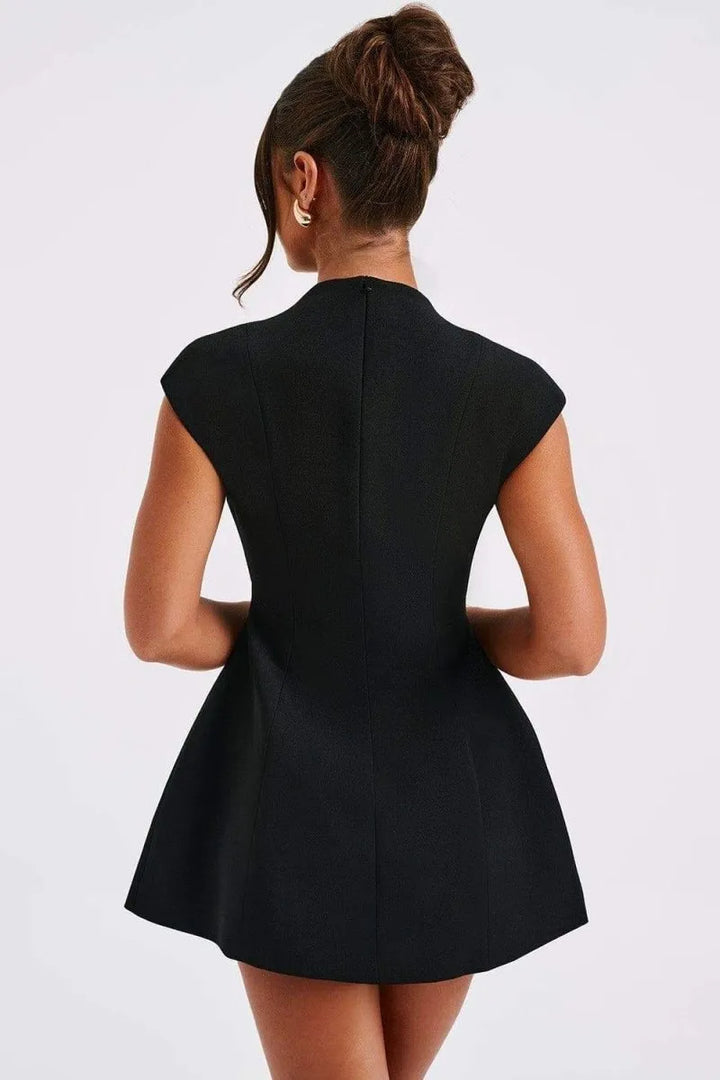 Fashionable women's cap sleeve mini dress with a flattering deep V-neckline and functional front patch pockets.