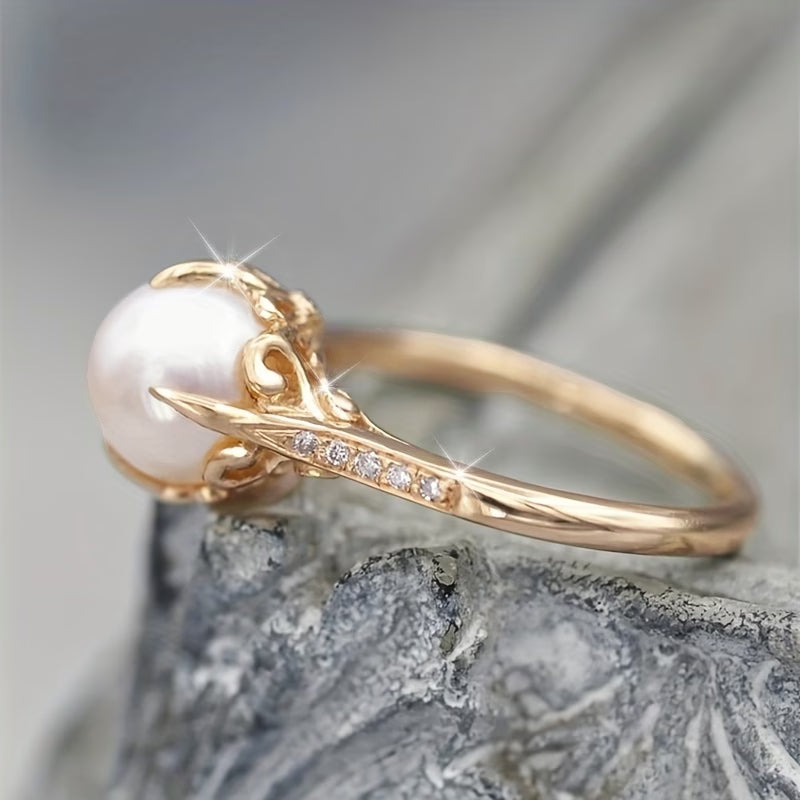 Women's delicate ring featuring a lustrous pearl and sparkling crystals, perfect elegant fashion accessory.