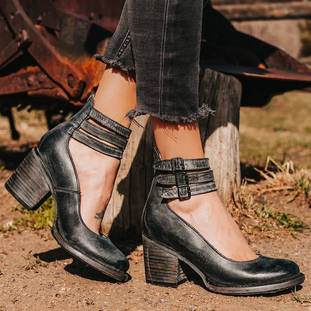 Elegant women's distressed block heel sandals featuring buckled ankle straps. Comfortable summer shoes.