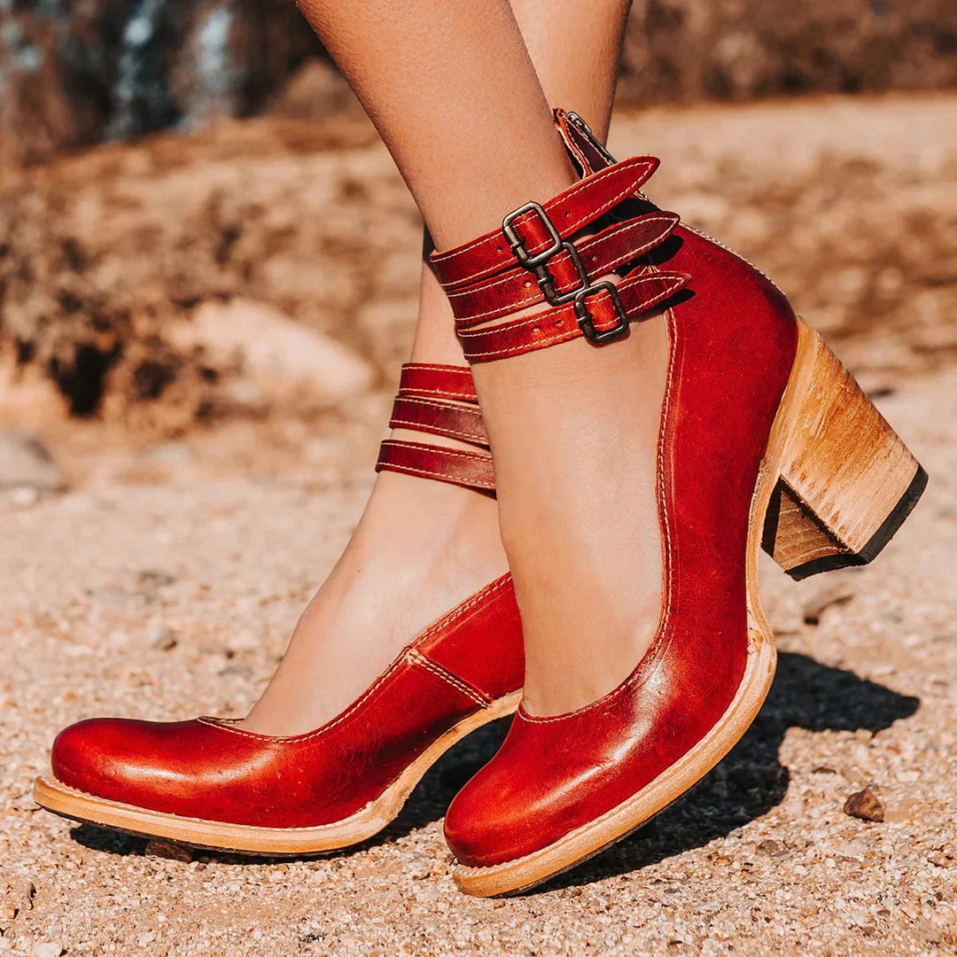 Stylish women's distressed block heel sandals with cut-out design & buckled ankle straps. Chic footwear.