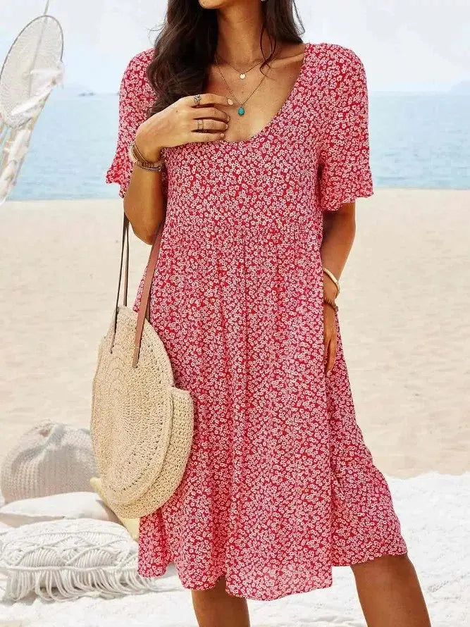 Women's ditsy floral mini dress with flutter sleeves. Perfect A-line summer dress for casual wear & warm weather.