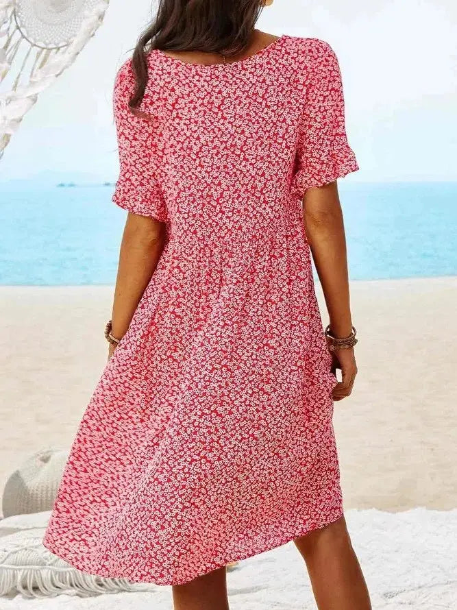 Breezy ditsy floral mini dress for women with elegant flutter sleeves. Comfortable A-line fit, ideal for summer fashion.