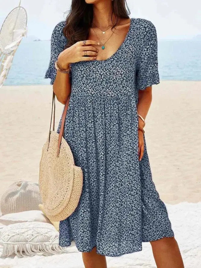 Stylish women's ditsy floral mini dress featuring delicate flutter sleeves & an A-line cut. Great for warm weather.