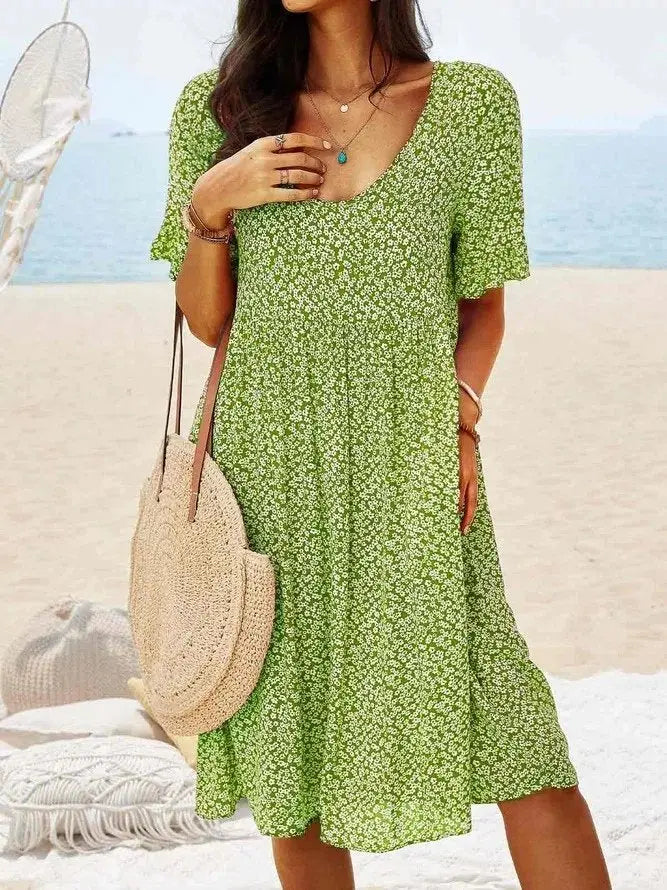 Chic women's ditsy floral mini dress, A-line cut with flowy flutter sleeves. A comfortable and fashionable summer choice.