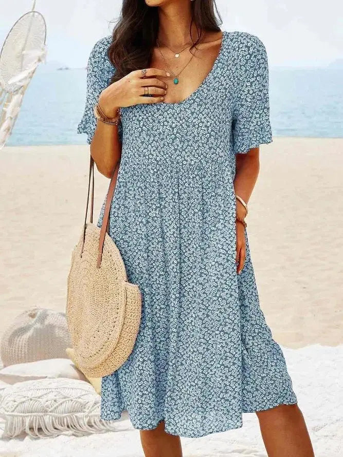 Ditsy floral women's mini dress, A-line silhouette with charming flutter sleeves. A comfortable & stylish summer dress.