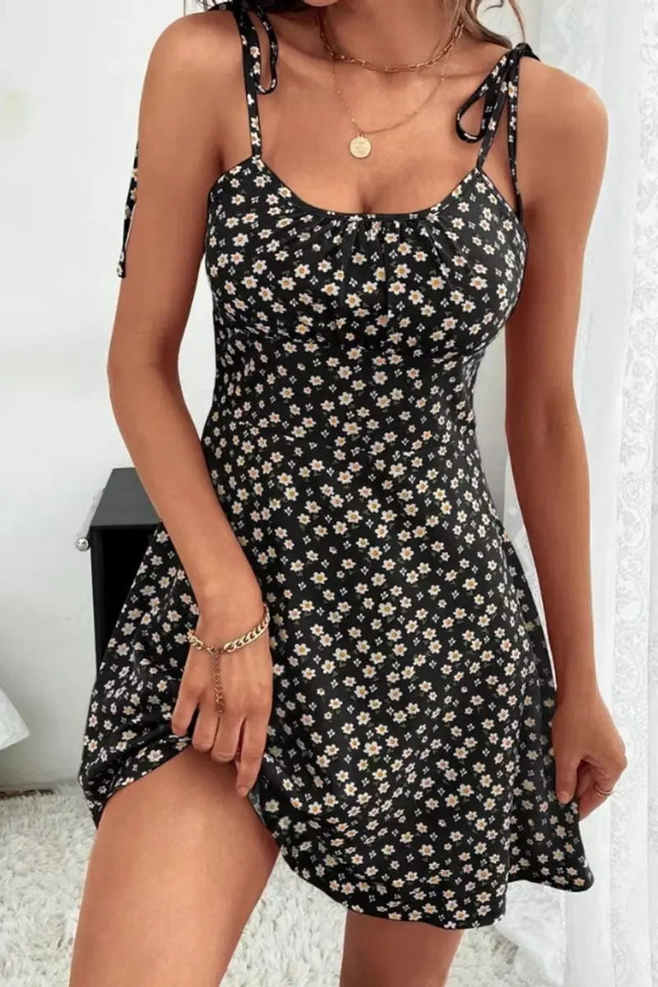 Elegant ditsy floral ruched mini dress for women, with delicate cami straps and a playful summer vibe.