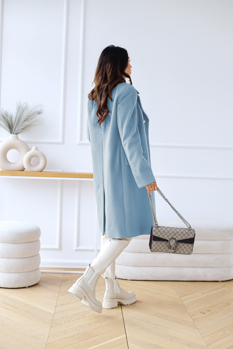 Chic double-breasted long coat for women, perfect for elegant fall and winter looks.