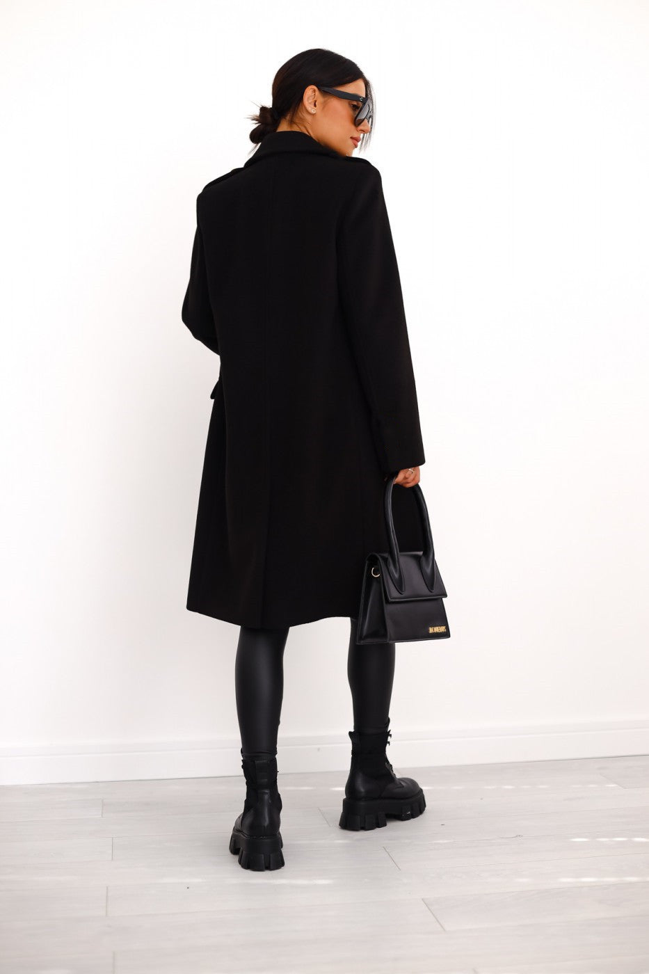 Chic women's long coat, double-breasted design, perfect for fall fashion.