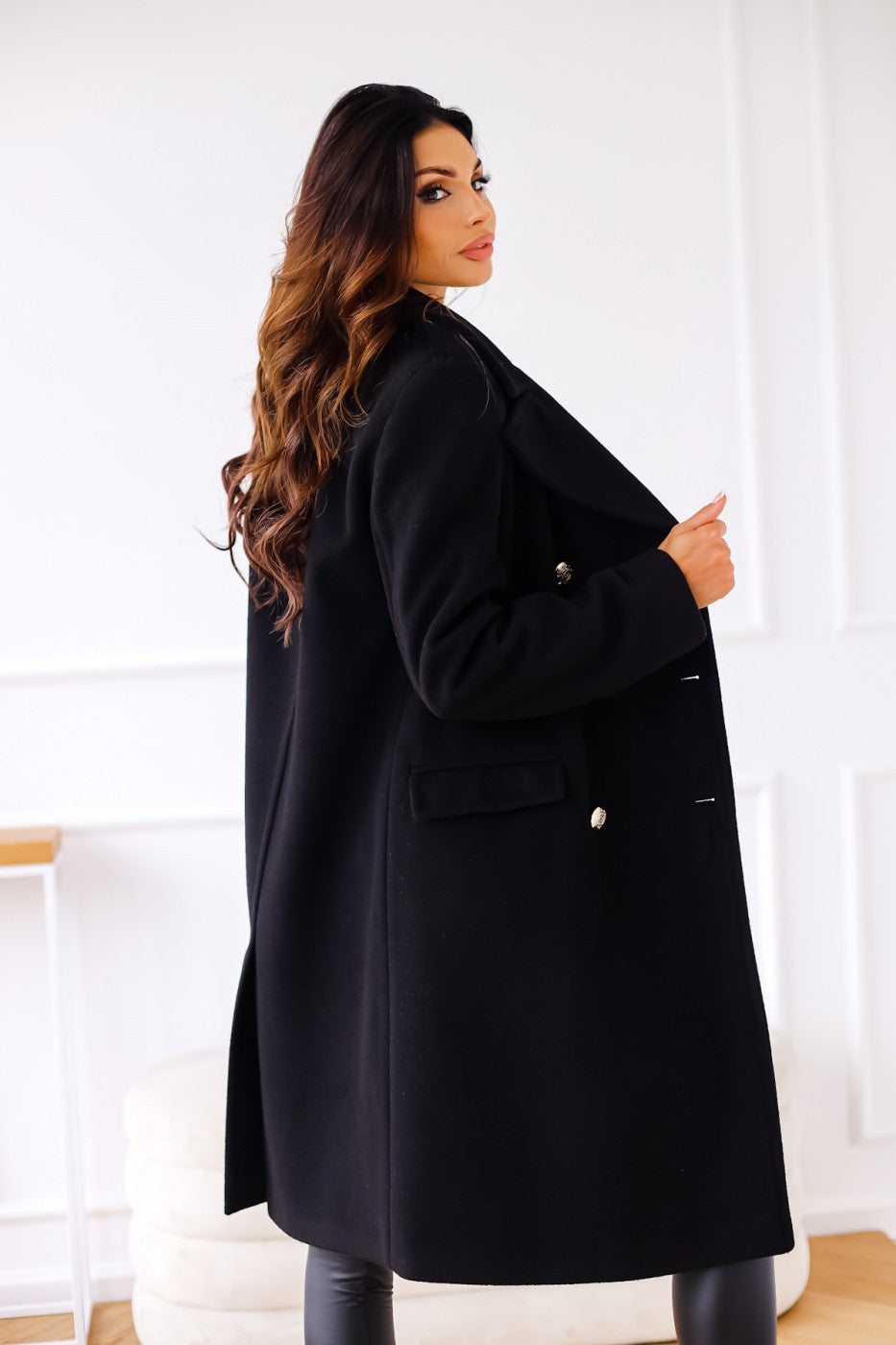 Classic women's long double-breasted winter coat, stylish and elegant outerwear.