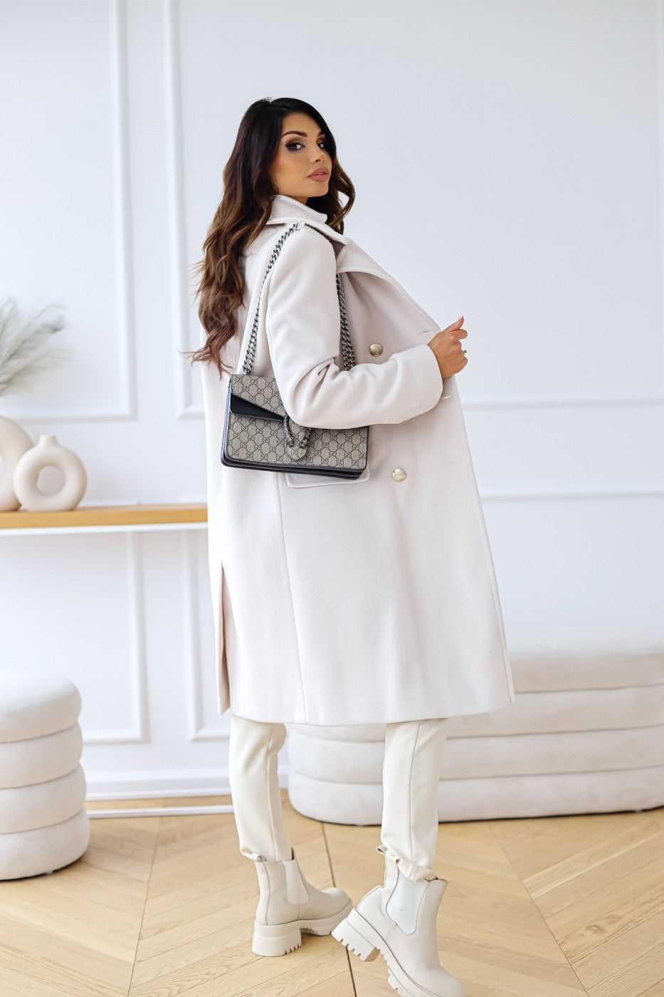 Warm double-breasted women's long coat, essential elegant outerwear for fall.