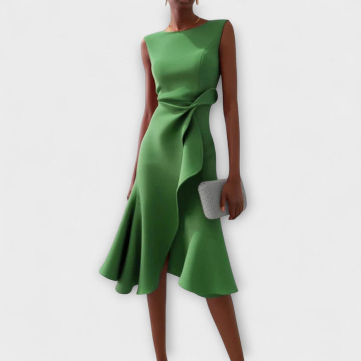 Sleeveless A-line midi dress for women. Draped asymmetric style, ideal as a wedding guest or party dress.