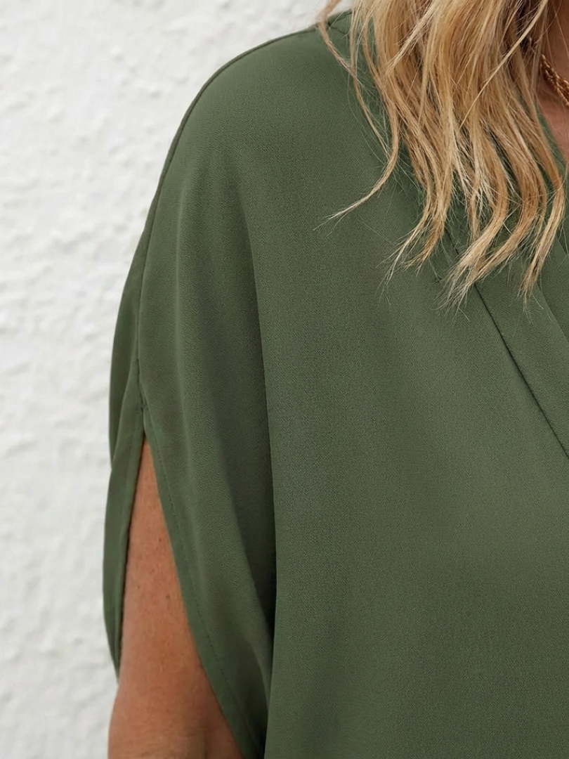 Elegant women's V-neck shift dress with draping, perfect for casual summer outings or travel. Relaxed fit.