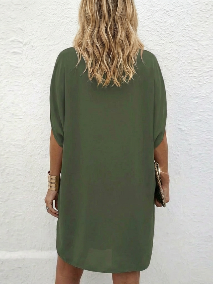 Comfortable women's draped V-neck shift dress, featuring a relaxed fit and cap sleeves, versatile for daily wear.