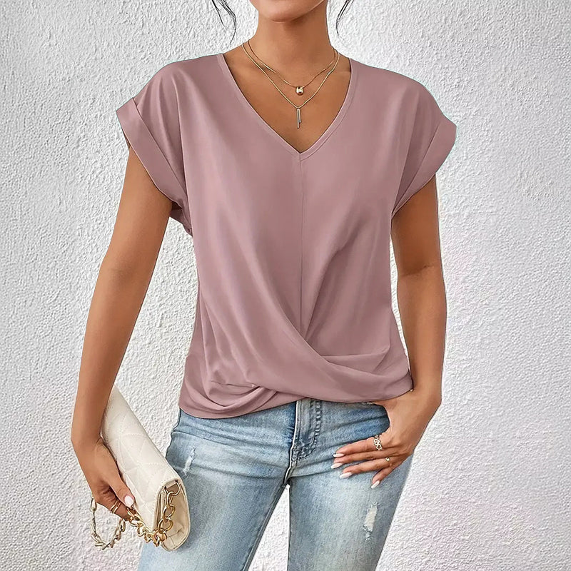 Women's draped V-neck short sleeve top, perfect for versatile everyday wear & elegant style. Comfortable modern design.