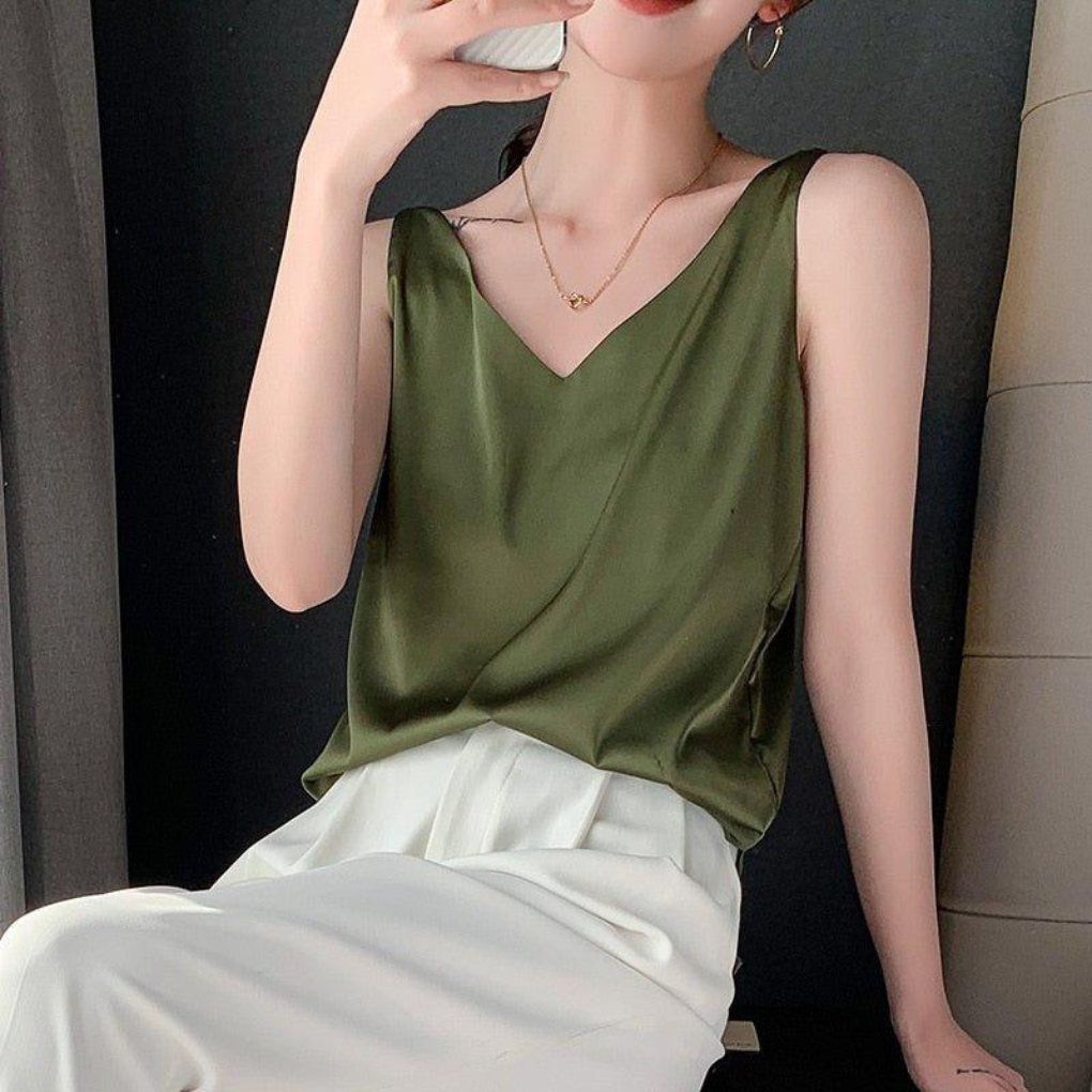 Women's draped V-neck tank top, elegant and versatile for casual wear or layered looks. Relaxed fit summer top.