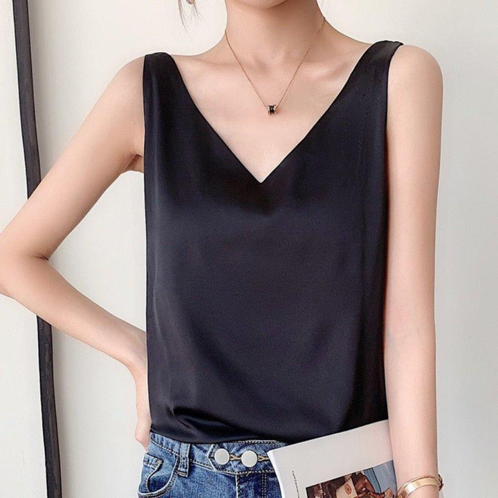 Chic women's sleeveless V-neck tank top with drapes, perfect for effortless casual style & summer fashion.