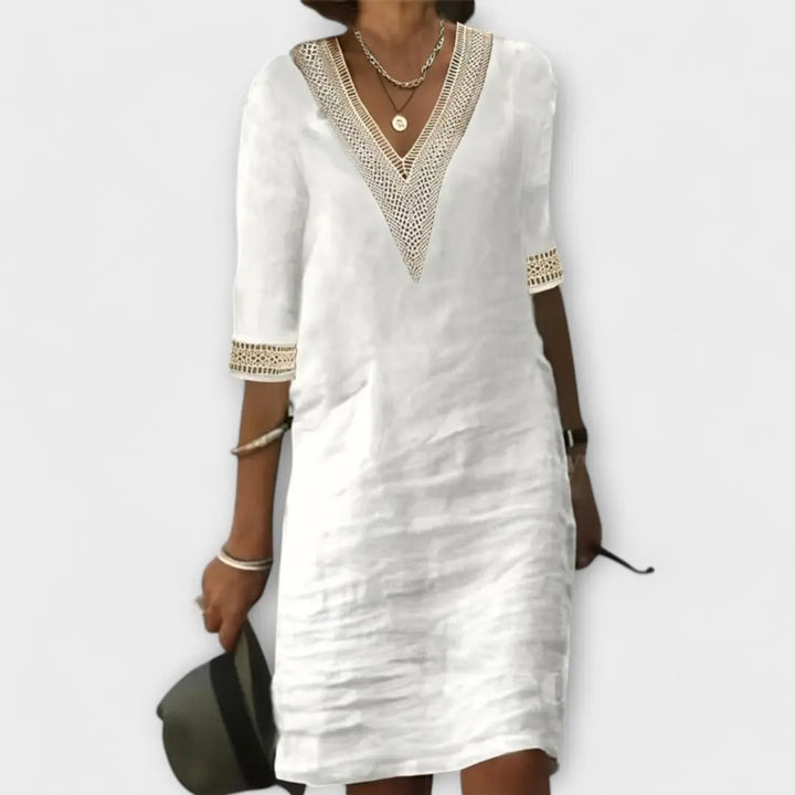 Women's effortless boho crochet mini dress with a chic V-neck, perfect for summer casual style.