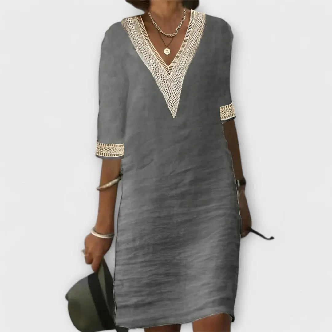 Flowy women's bohemian mini dress with intricate crochet details, V-neck, ideal for summer everyday wear.