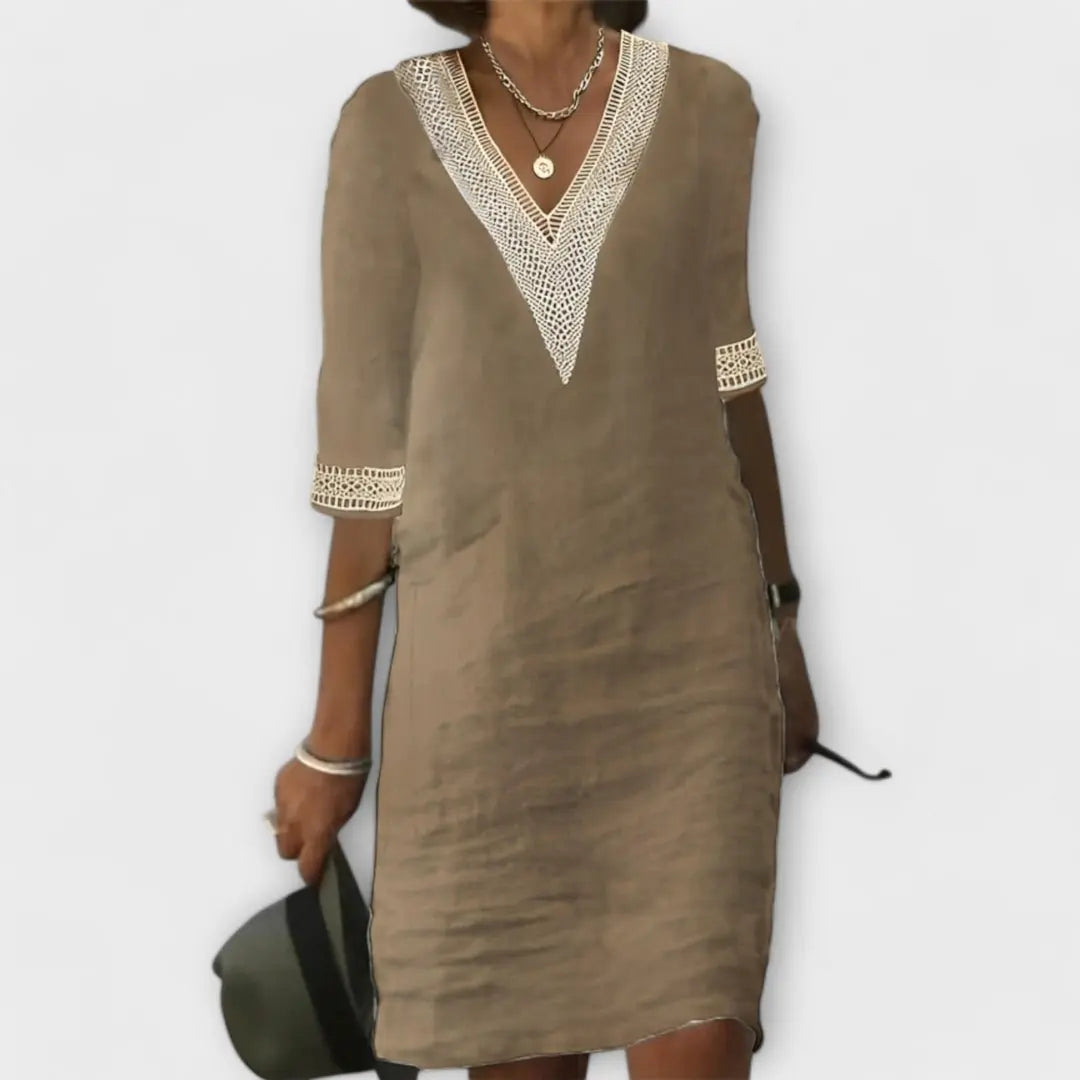 Casual women's boho mini dress with a V-neck, crochet texture, and 3/4 sleeves for ultimate summer comfort.