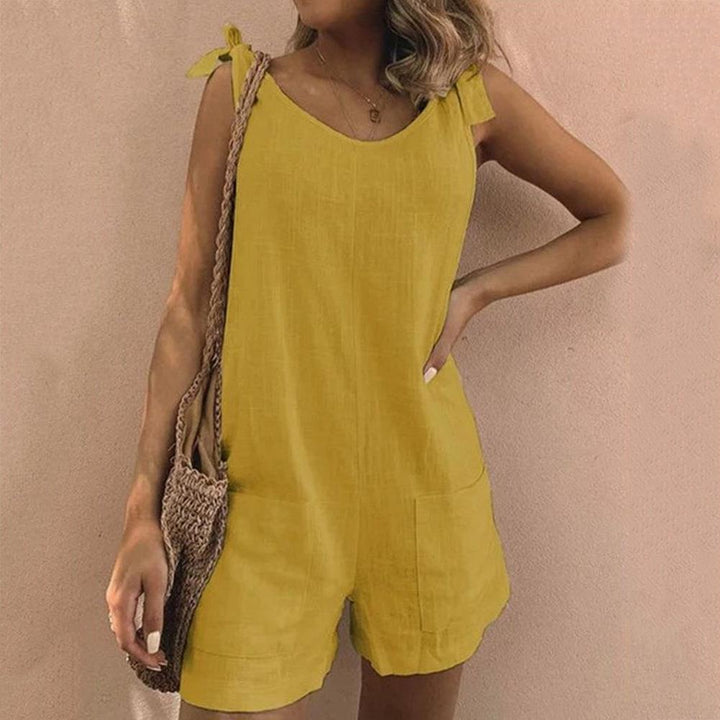Casual bow-strap playsuit for women with pockets, ideal for vacation wear or comfortable everyday summer style.