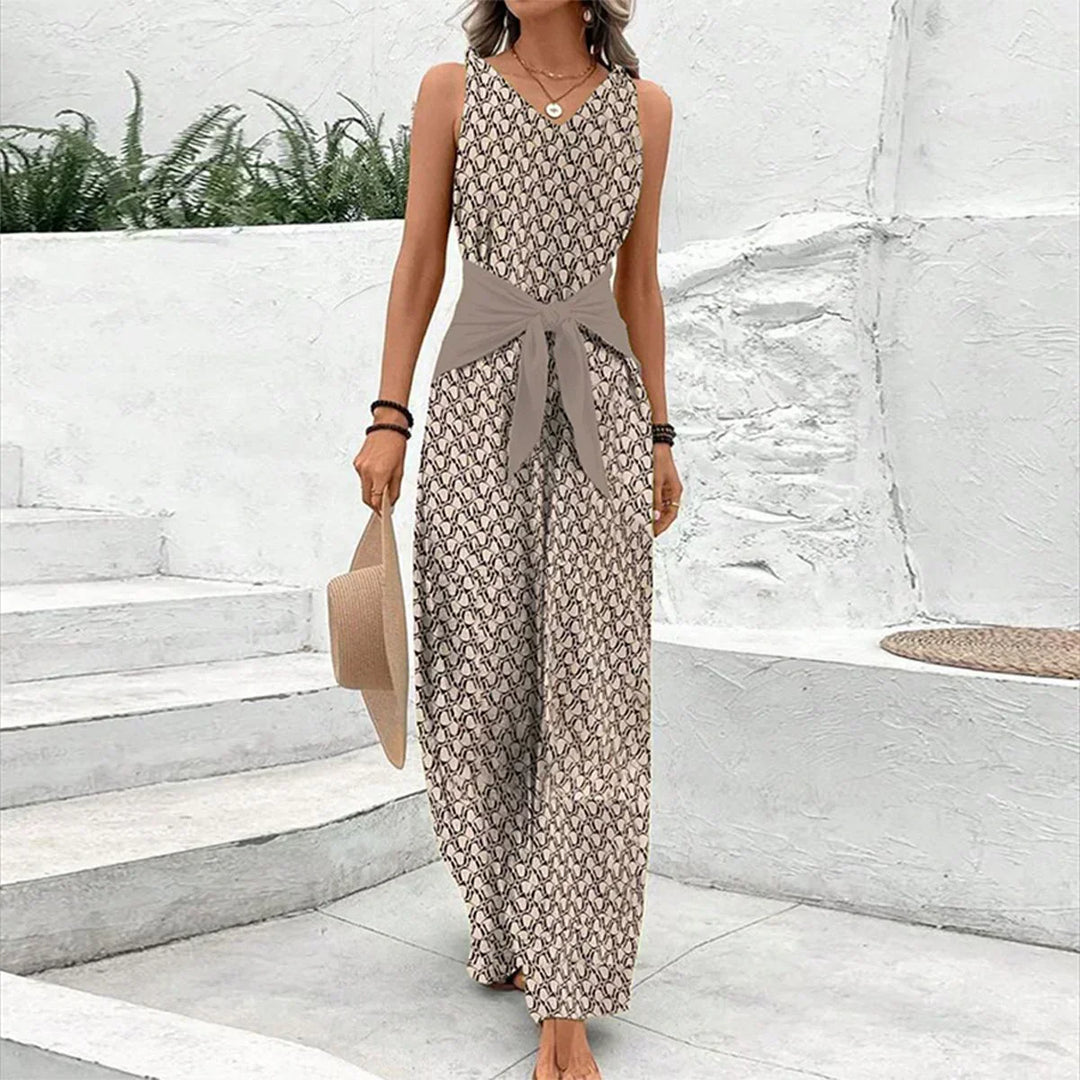 Women's effortless brown sleeveless tie-waist jumpsuit. Elegant one-piece for casual wear, perfect versatile summer fashion.