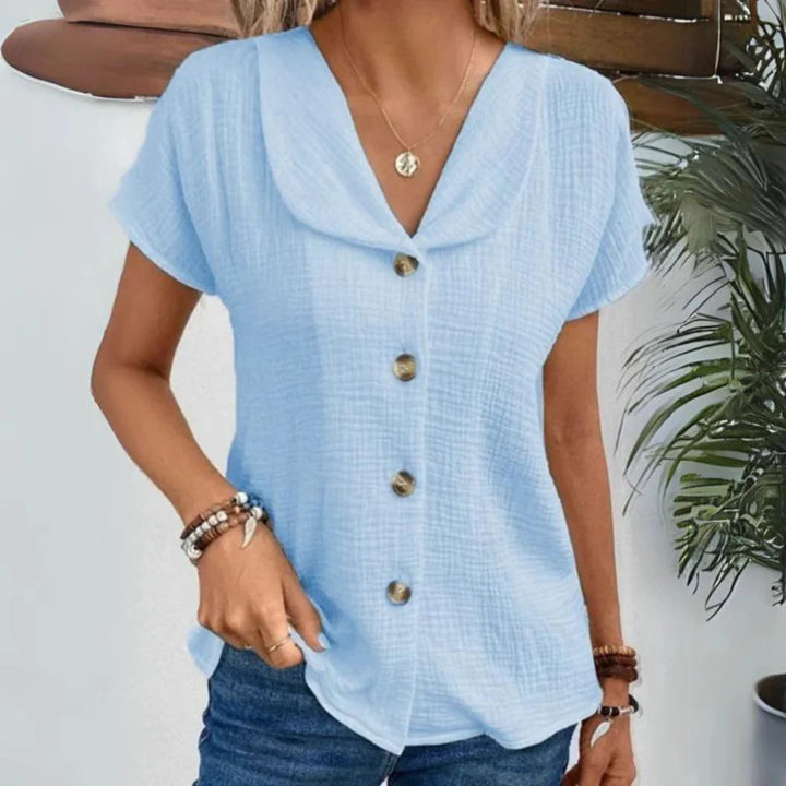 Stylish women's short sleeve button-down blouse. Collared top with a relaxed fit for chic summer and casual outfits.