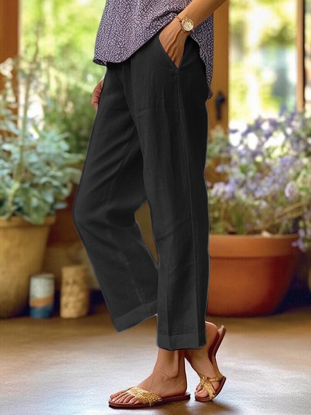 Stylish black women's relaxed fit straight leg trousers, perfect for comfortable office or casual wear.