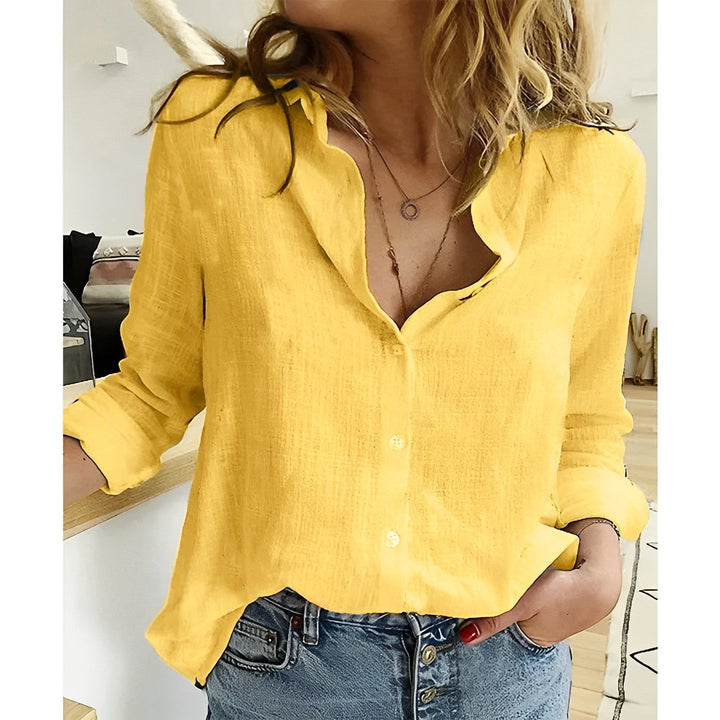 Relaxed fit long sleeve blouse for women, showcasing its comfortable and breezy design. Classic style spring shirt.