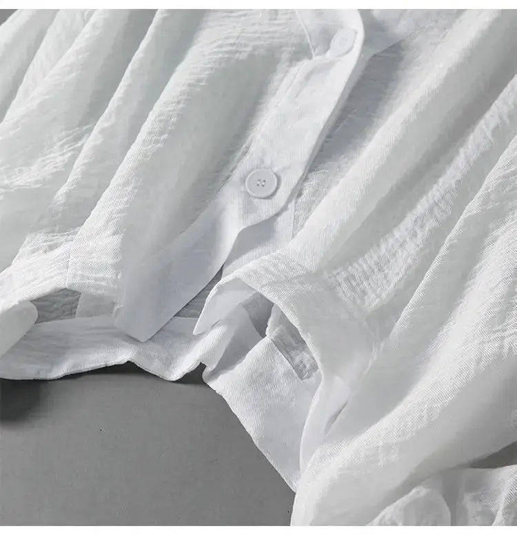 Lightweight cotton linen women's blouse, featuring batwing sleeves & button detail, a versatile relaxed fit shirt.