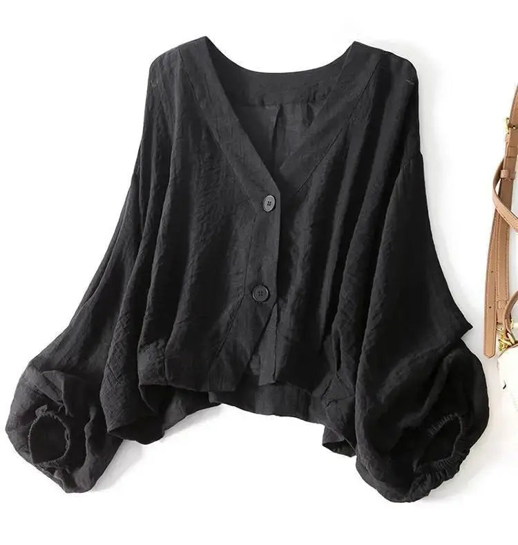 Stylish women's batwing sleeve blouse in cotton linen, with chic button detail & a comfortable loose fit.