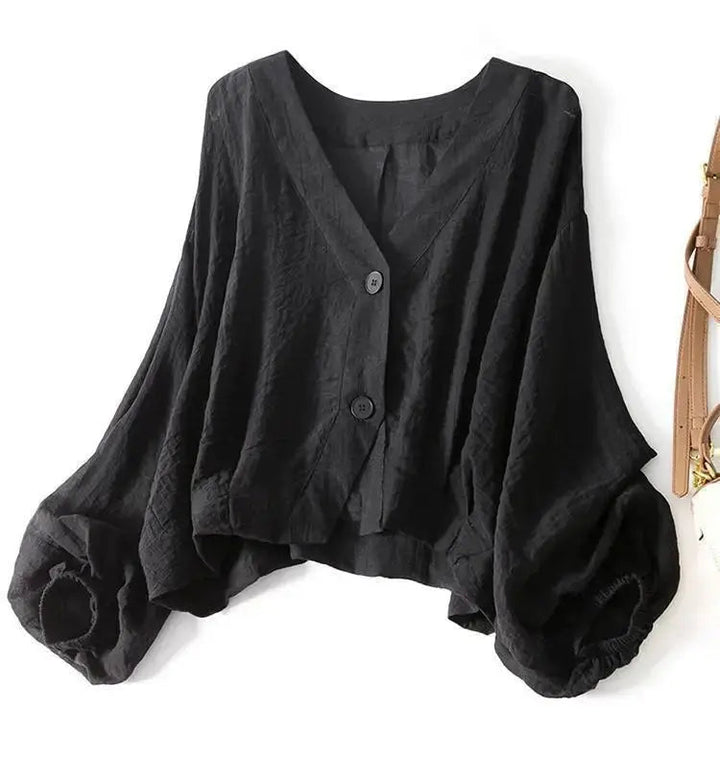 Stylish women's batwing sleeve blouse in cotton linen, with chic button detail & a comfortable loose fit.