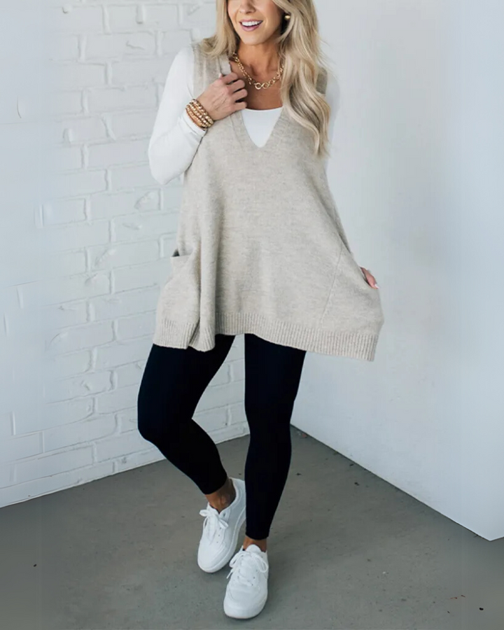 Soft knit women's layering vest in a rich green hue, perfect for adding warmth to fall & winter looks.