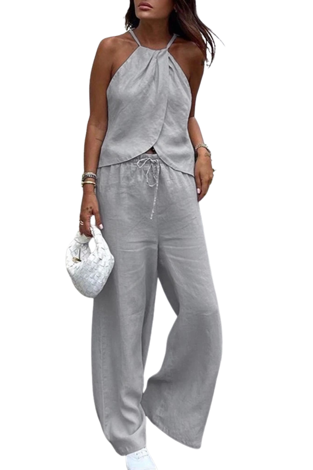 Stylish women's summer set including a flattering halter top and trendy wide leg trousers. Perfect for a chic look.