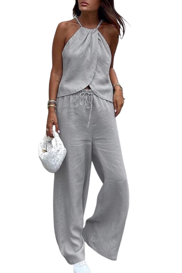 Stylish women's summer set including a flattering halter top and trendy wide leg trousers. Perfect for a chic look.
