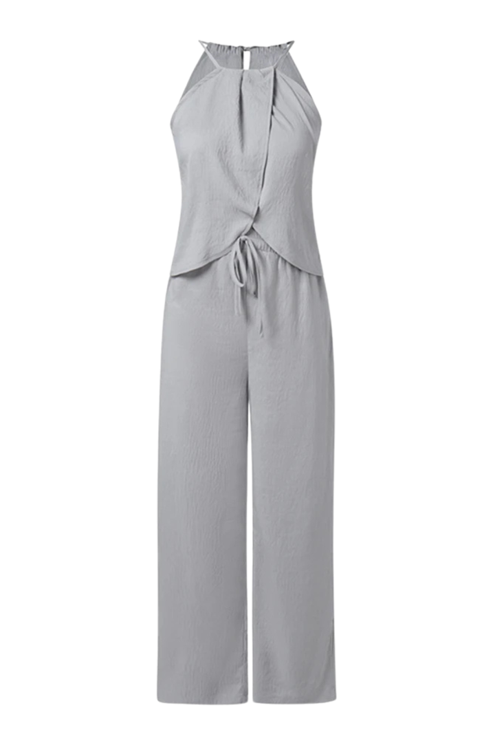 Comfortable women's summer suit, featuring a coordinated halter top & wide leg trousers. Relaxed yet elegant outfit.
