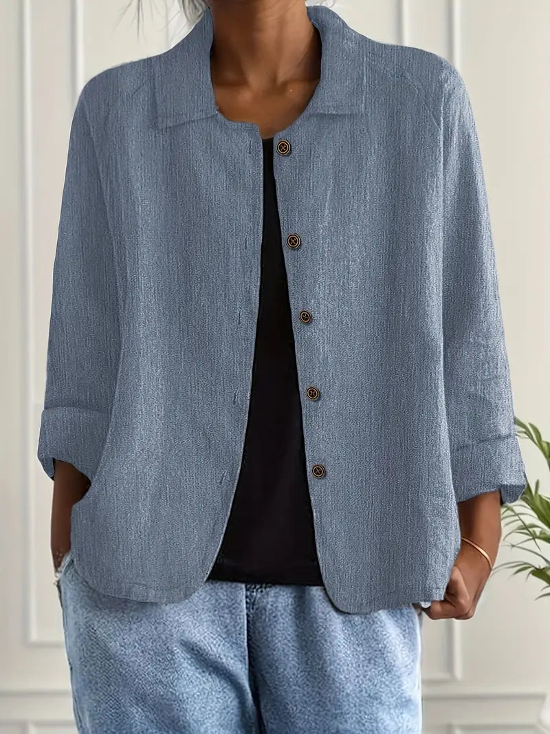 Relaxed fit women's long sleeve button-up blouse, an elegant and versatile fashion top.
