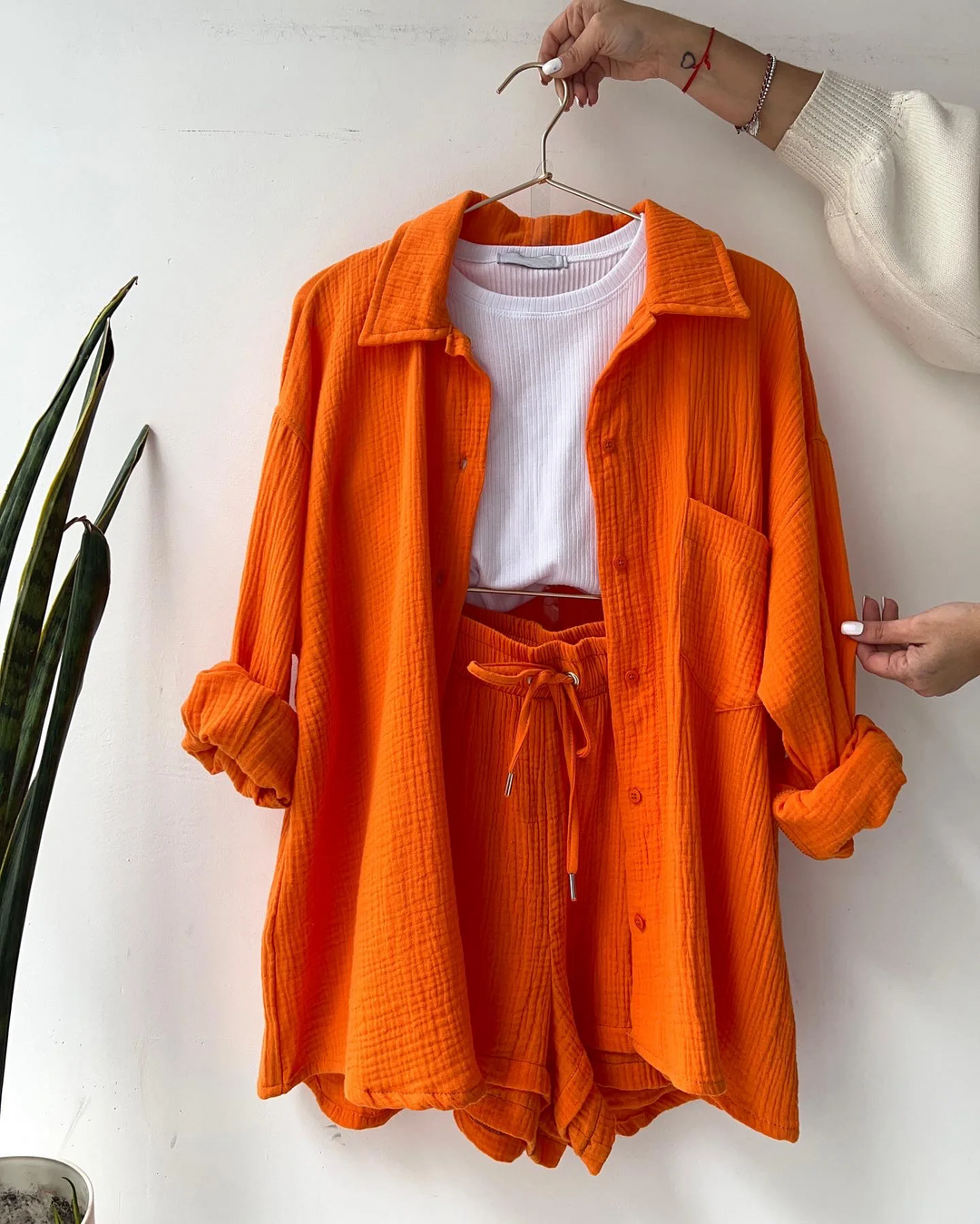 Chic women's two-piece shorts set in soft fabric, ideal for spring & elegant loungewear.